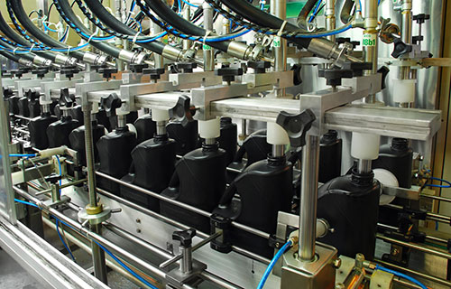 Oil bottles on production line
