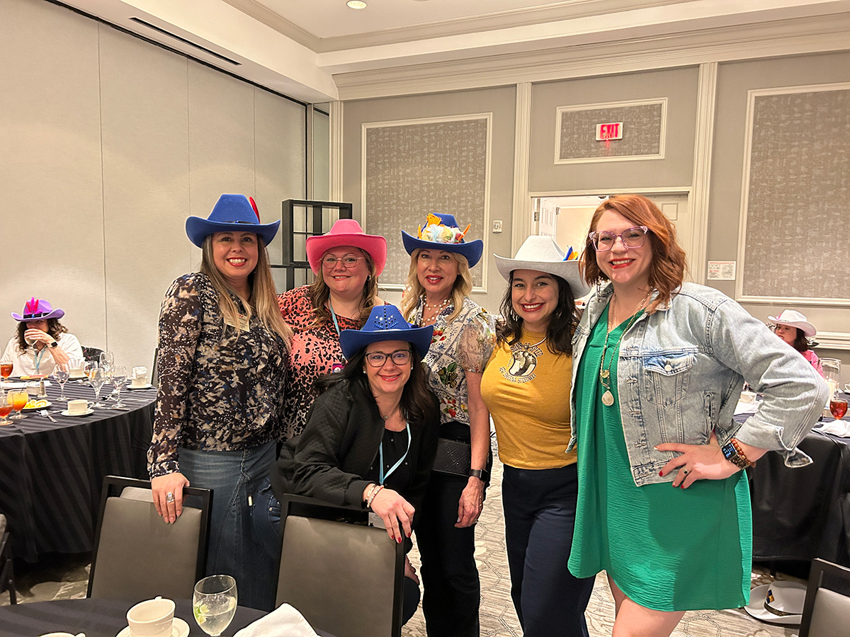 Recap: 2024 SBN Women’s Leadership Forum Empowers Females in Automotive  - Group of women smiling with cowboy hats on