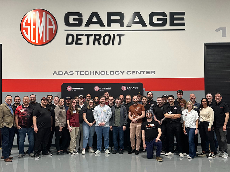 Group shot of FLN Members at the SEMA Garage