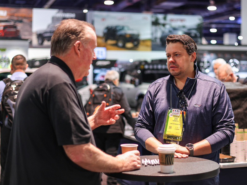 Two guys talking over coffee