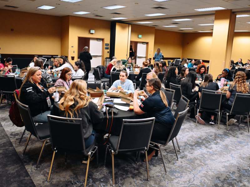 SBN participants talk to each other at round tables