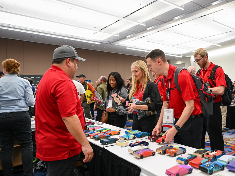 TORA Reception attendees browse pinewood derby cars