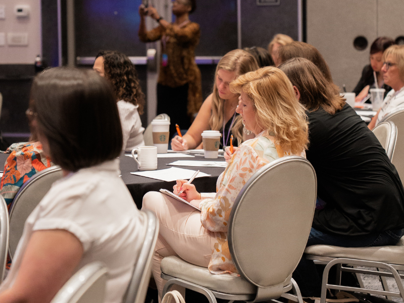 Women sitting and listening to speaker during presentation
