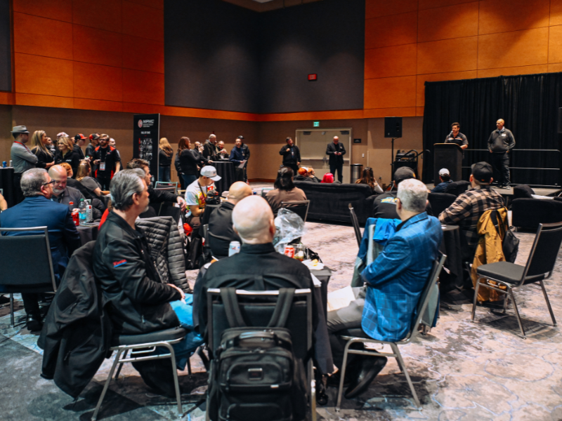 Attendees of the cross-council reception listen to speakers at podiums