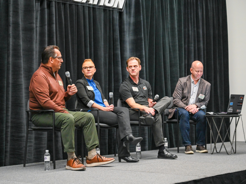 Panelists speaking with one another