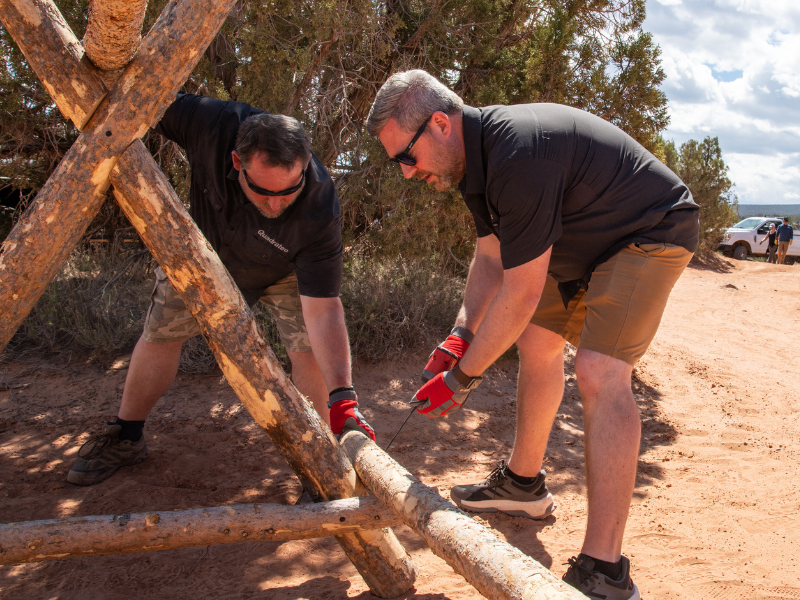 Volunteers repairing fencing along trail