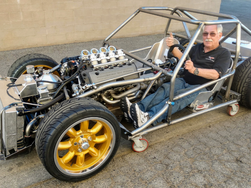 Bill Holland sitting in his current restomod project. 1974 TVR 2500M