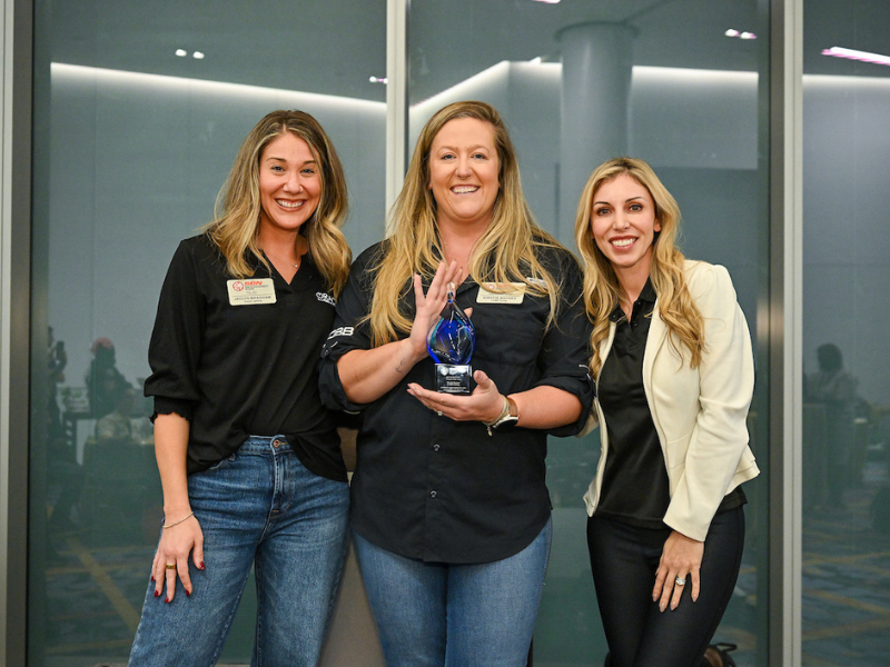 Kristin Backes posing with award.