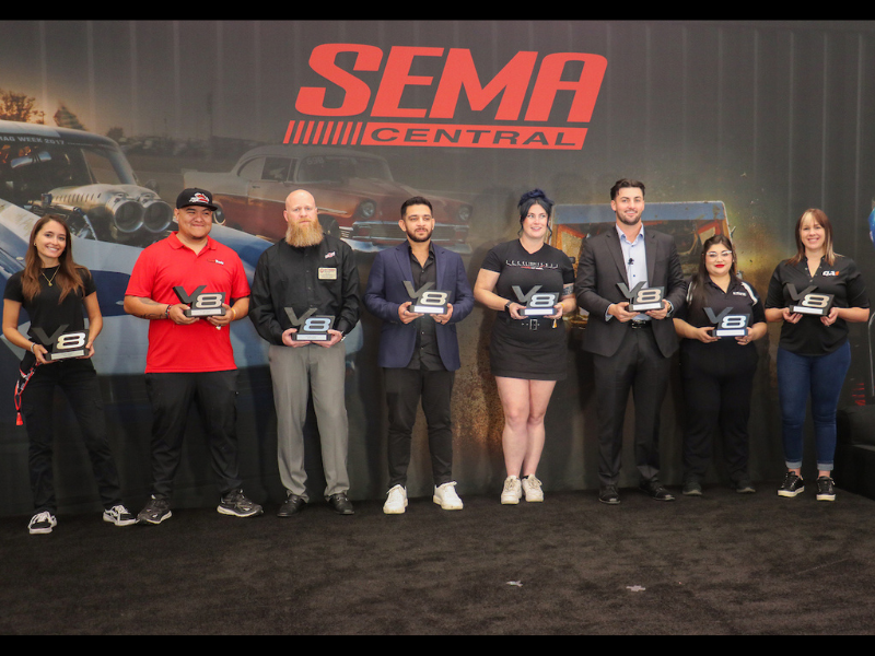 Visionary 8 Winners posing with their awards.