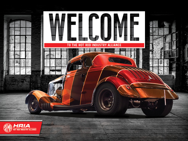 Hot Rod in a old warehouse with Welcome text about it.