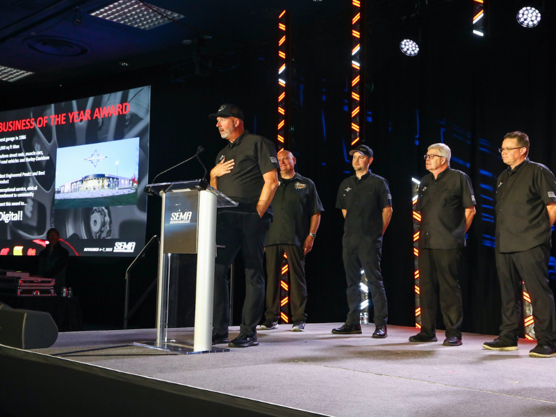 Award winners on stage accepting award.