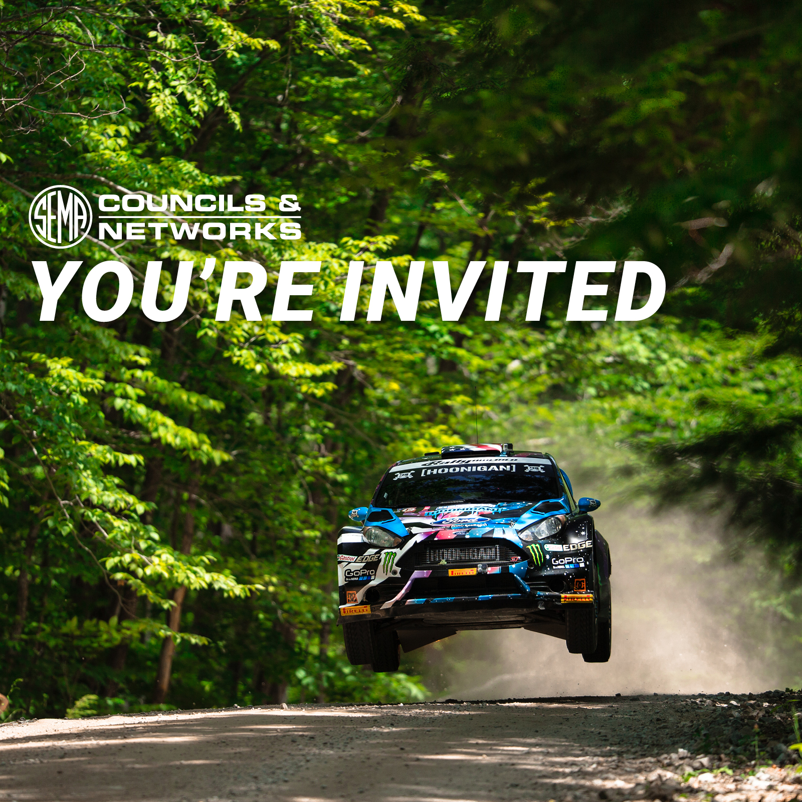 FLN You're invited. Rally car catching air while driving down back road.
