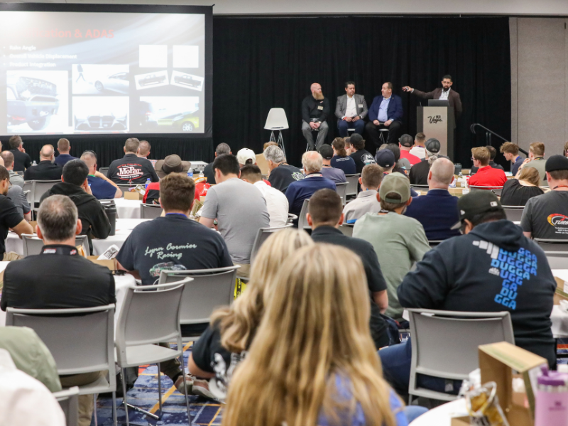 People seated listening to a presentation