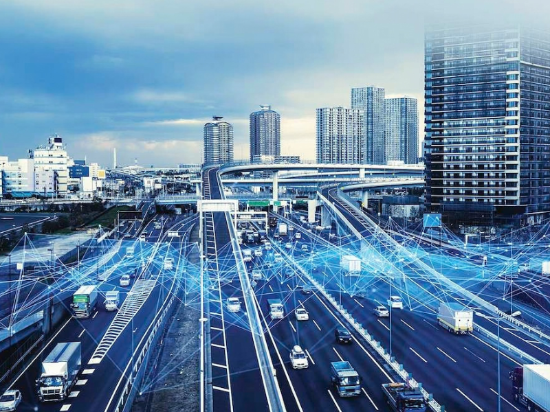 Futuristic display overlaying an image of busy freeways