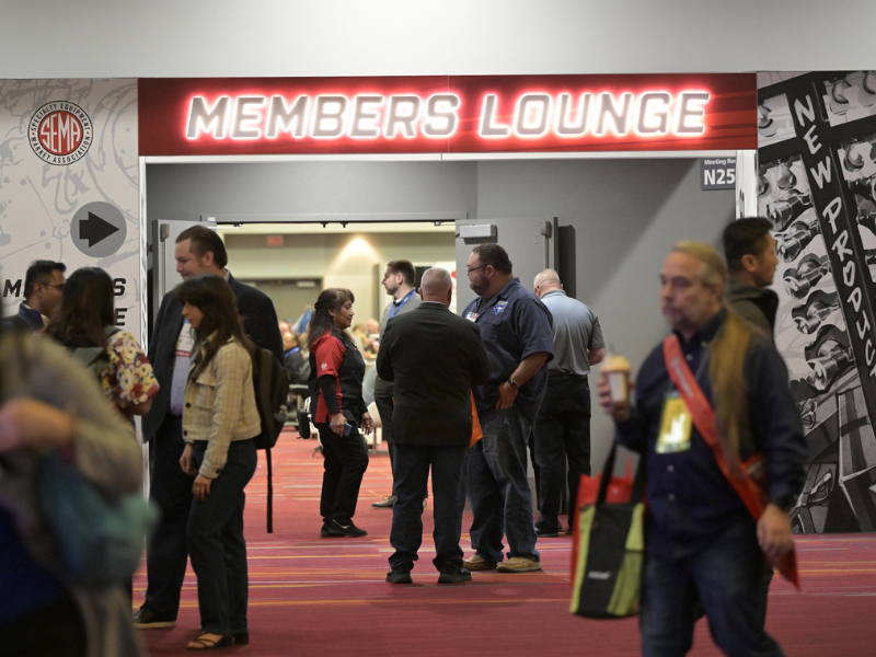 People gathered in front of Member Lounge at the SEMA Show