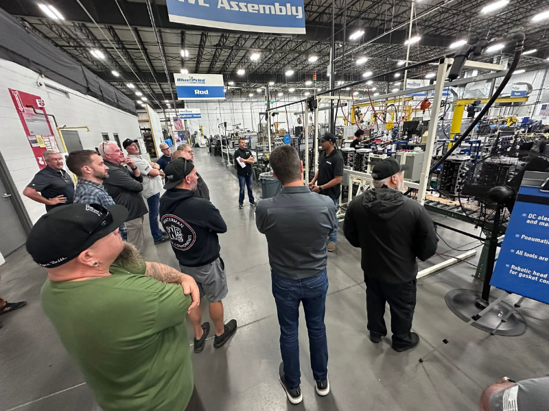 Attendees tour factory at SEMA Fuel Your Future