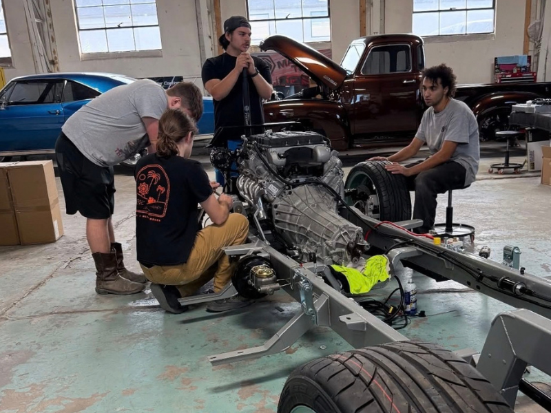 Four guys working on a build
