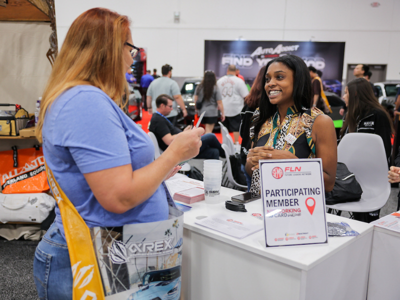 Two women speaking to each other at the SBN Booth