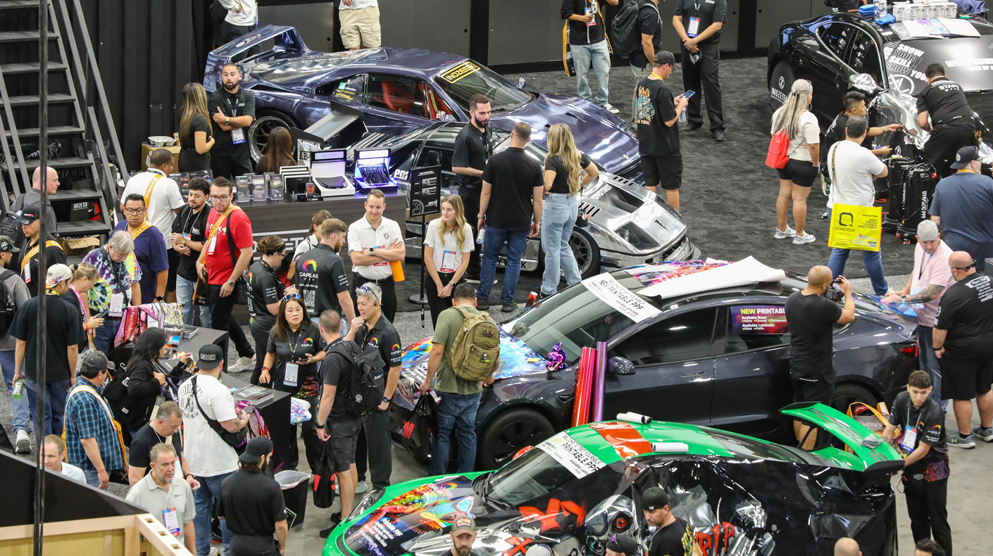 An image of a crowded SEMA Show booth.