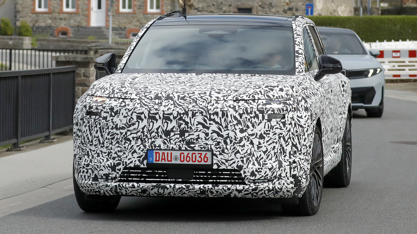 An image of the front of a camouflaged Lexus TZ.
