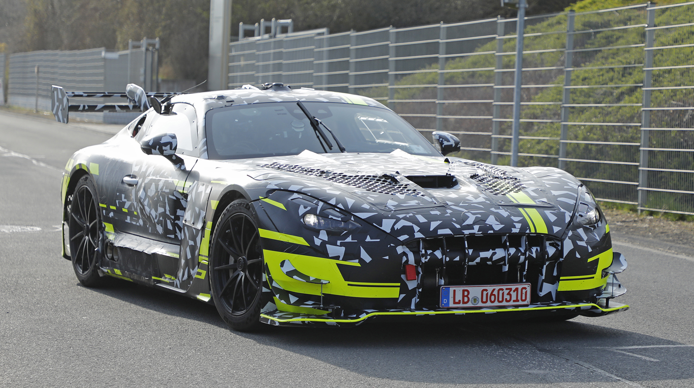 An image of a camouflaged Mercedes AMG Coupe on the race track.