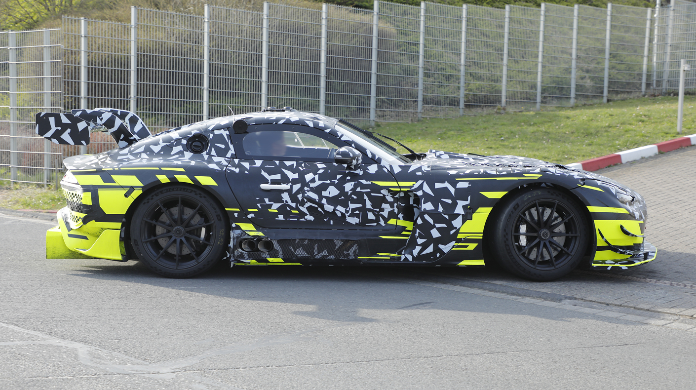 An image of a camouflaged Mercedes AMG Coupe on the race track.