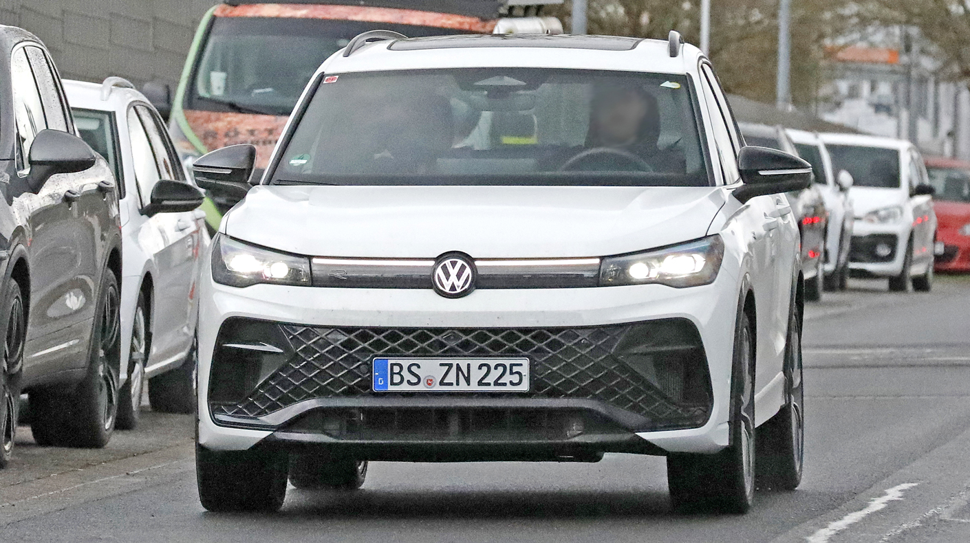 A front-facing Volkswagen Tiguan R drives on the road.