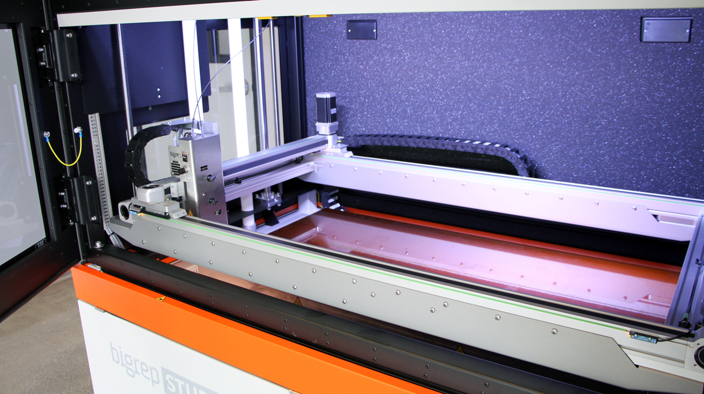 A large format 3D printer in SEMA Garage.