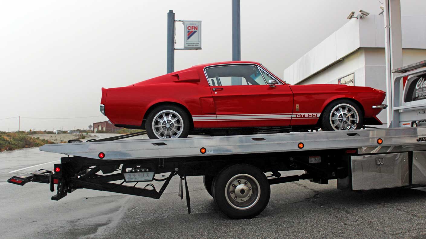 An image of a Mustang on a tow vehicle.