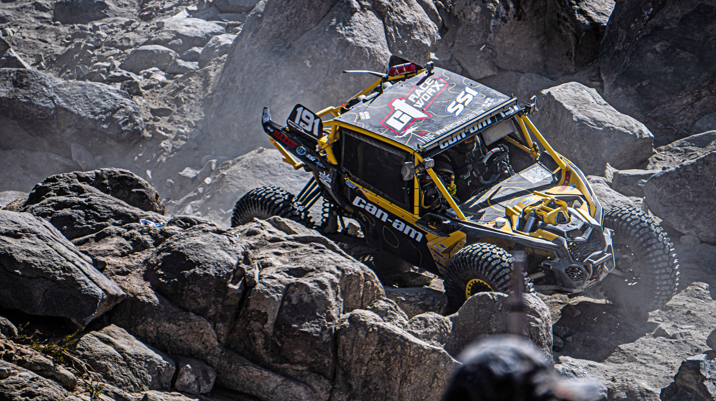 An image of a Can-Am going through the rocks at King of the Hammers.