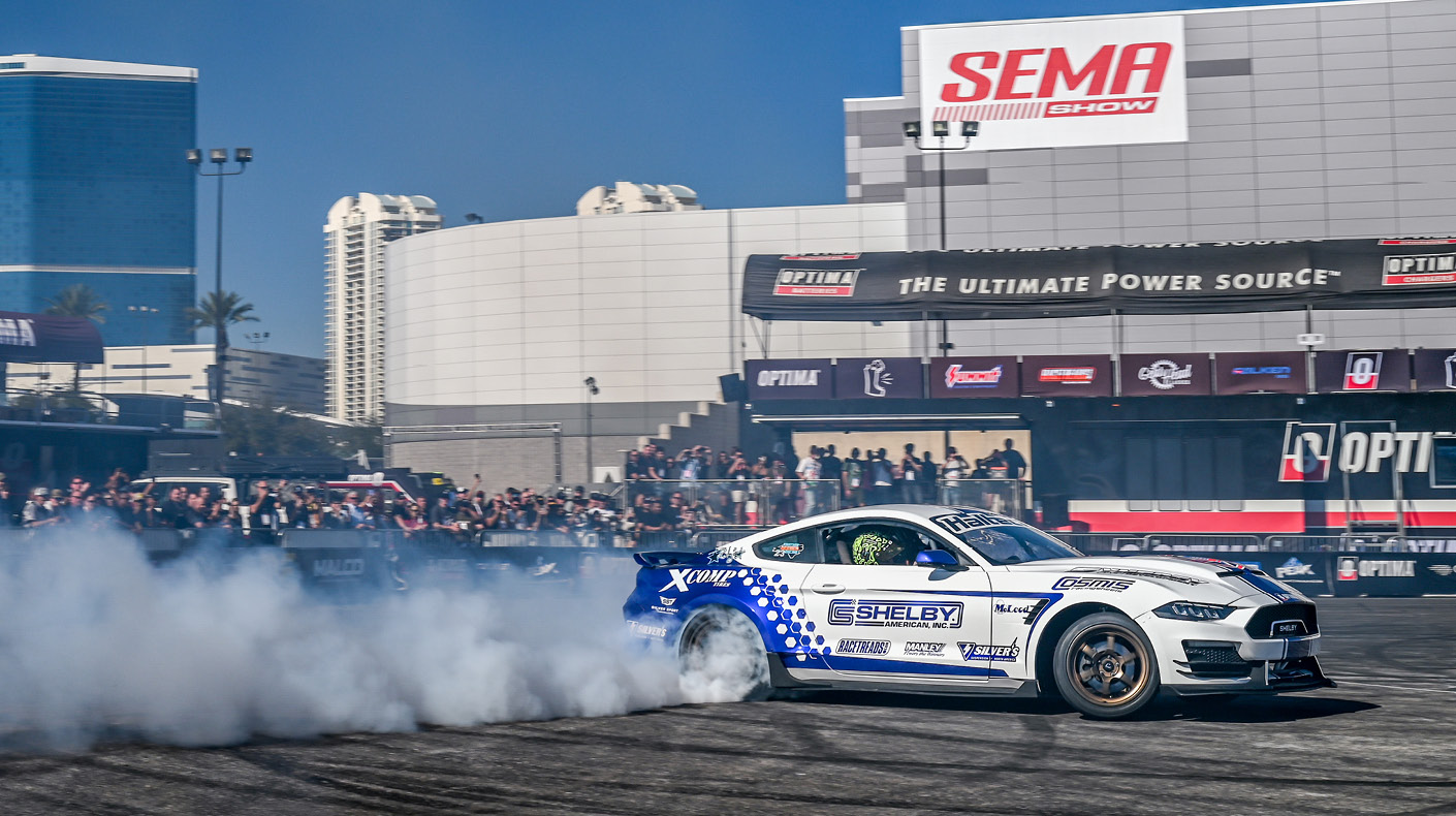An image of a drifting Mustang at the SEMA Show.