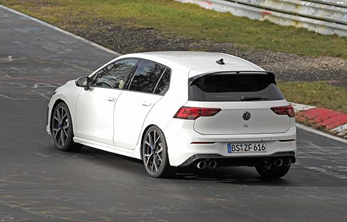 Rear of White 2024 Volkswagen Golf R on track