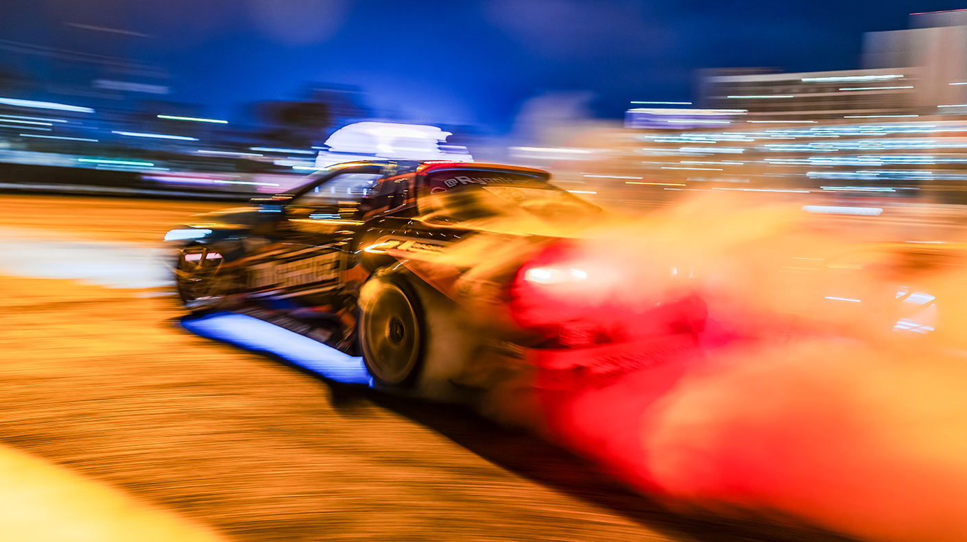 Drift car smoking tires at SEMA Fest.
