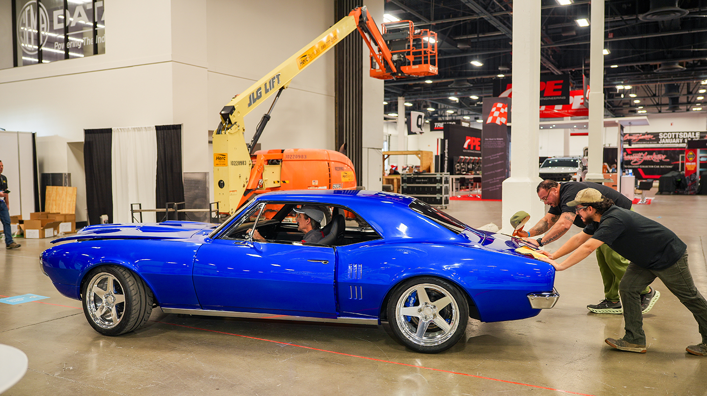 Exhibitors setting up their SEMA Show booth.