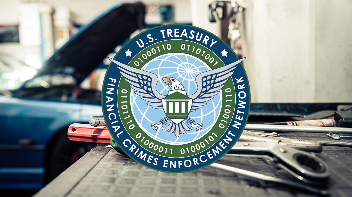 FinCEN logo over an auto shop.