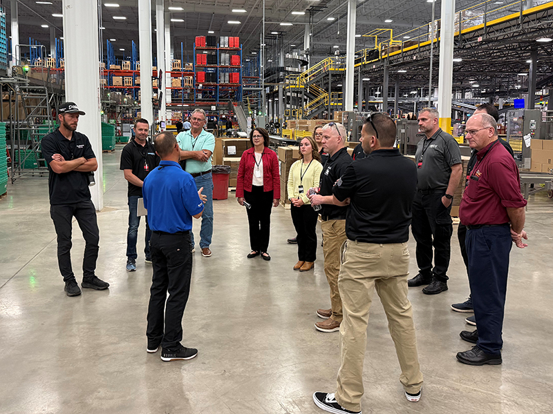 Michigan lawmakers touring Lane Automotive.