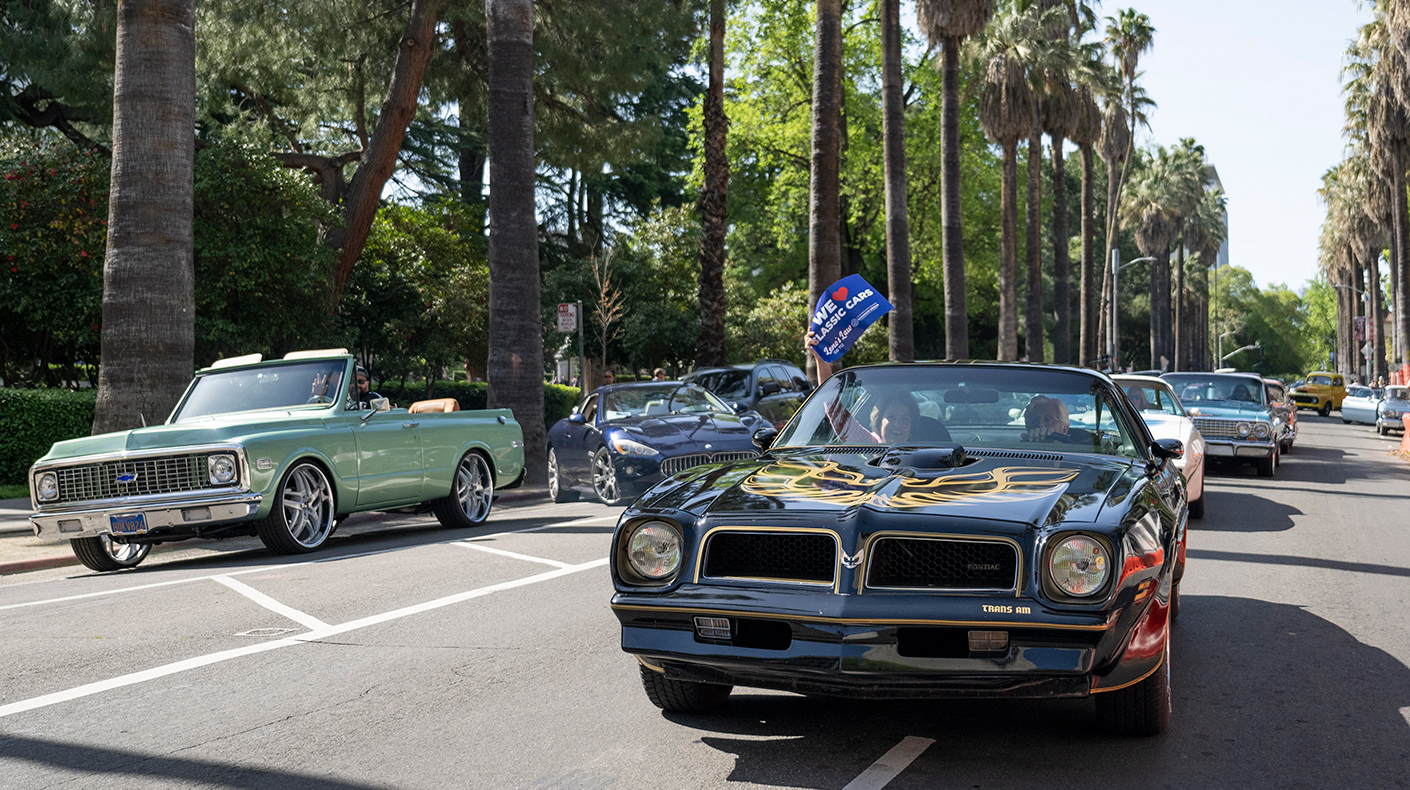 Jay Leno and Senator Shannon Grove in a classic car.