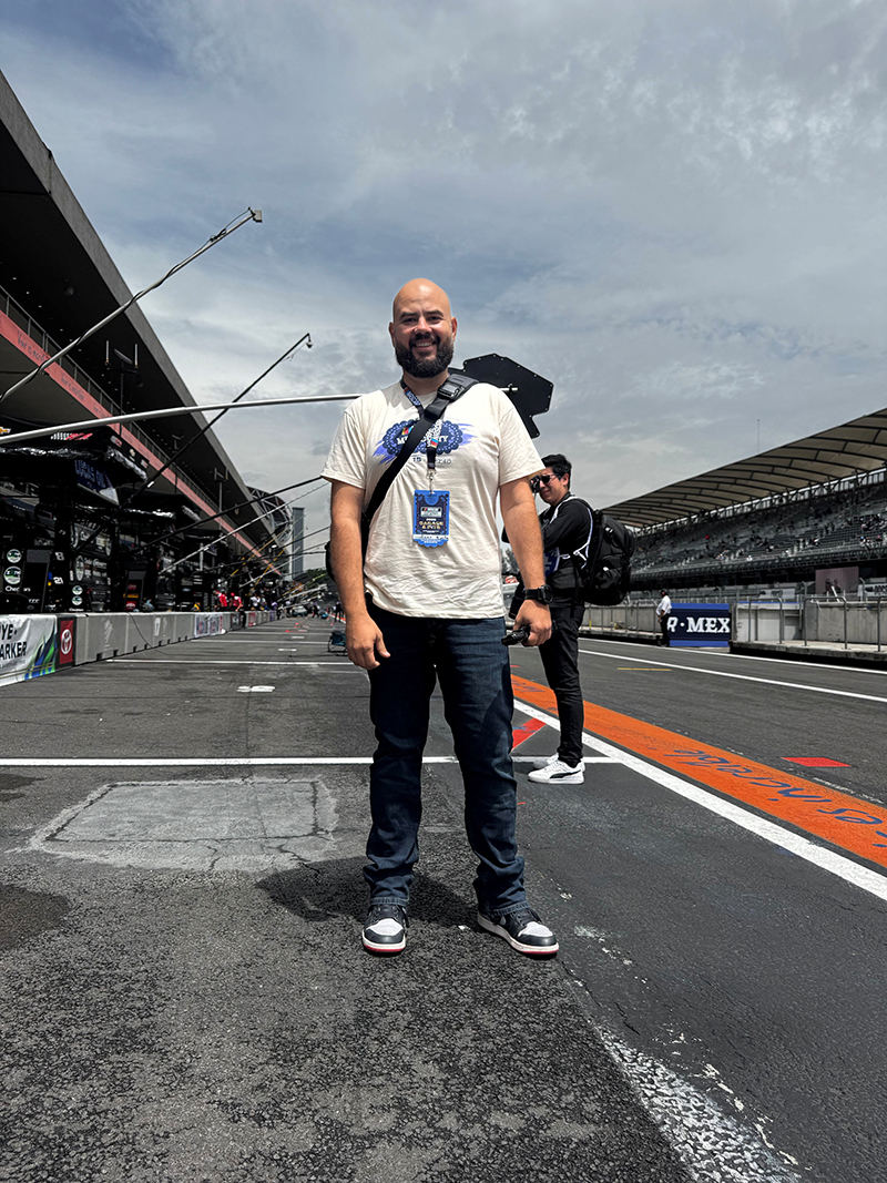 Guillermo Moeller standing on pit lane at a race.