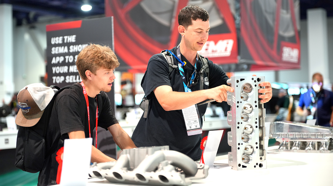 SEMA Show attendees looking at products in the New Products Showcase.