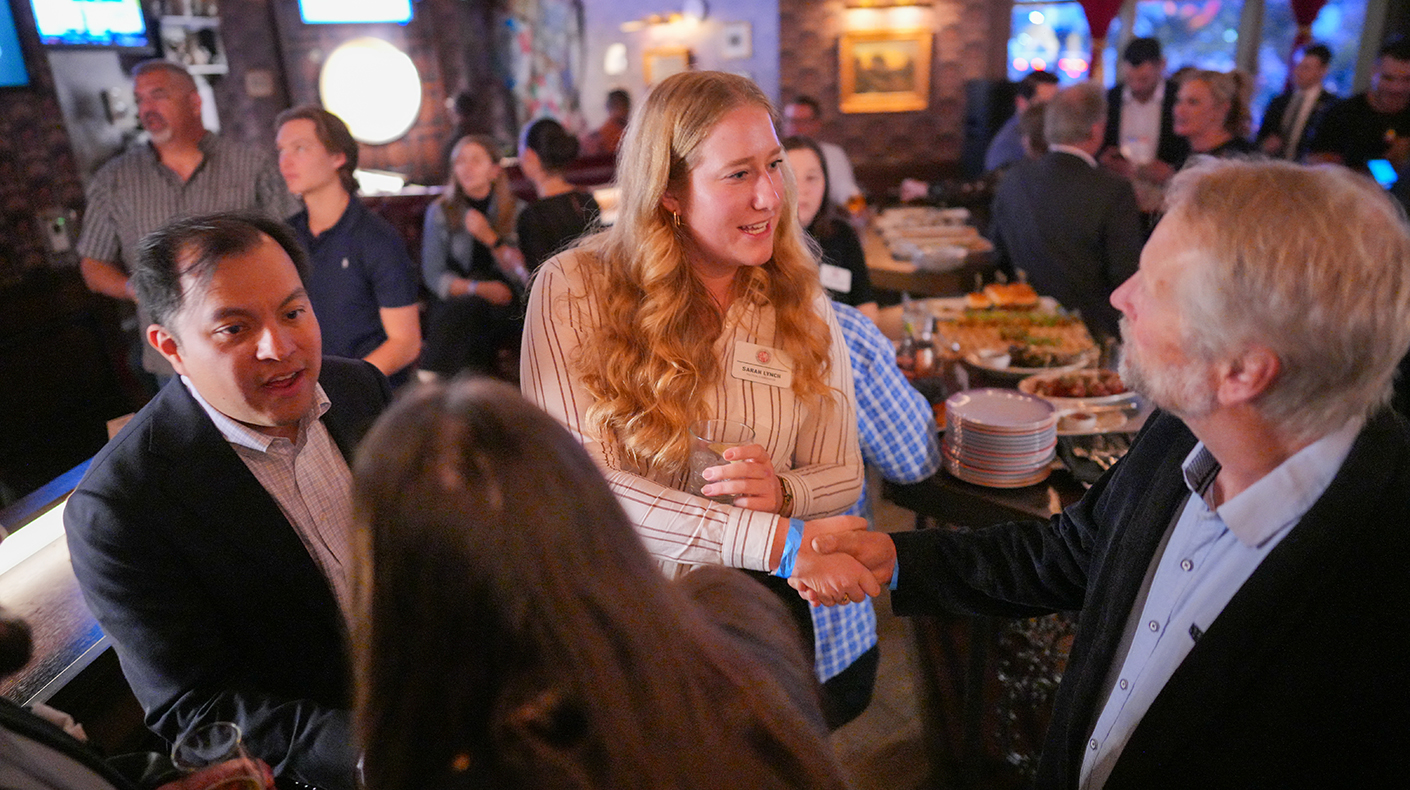 SEMA Show attendees networking at an after-hours event.