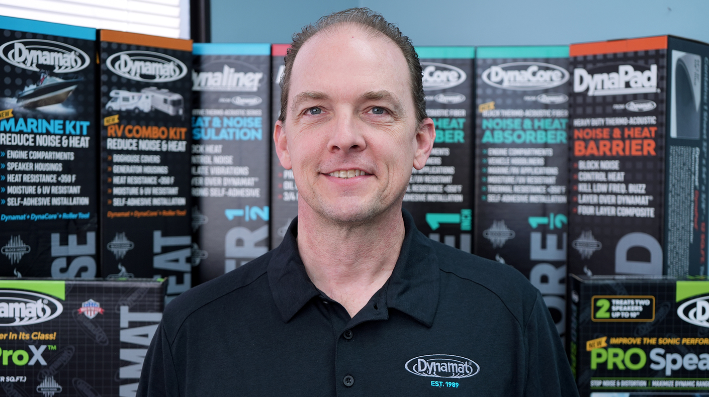 A headshot of Pat Johnson in front of Dynamat products.