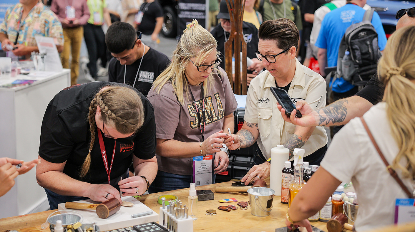 Attendees taking part in a hands-on workshop in the 2025 SEMA Show SBN booth.