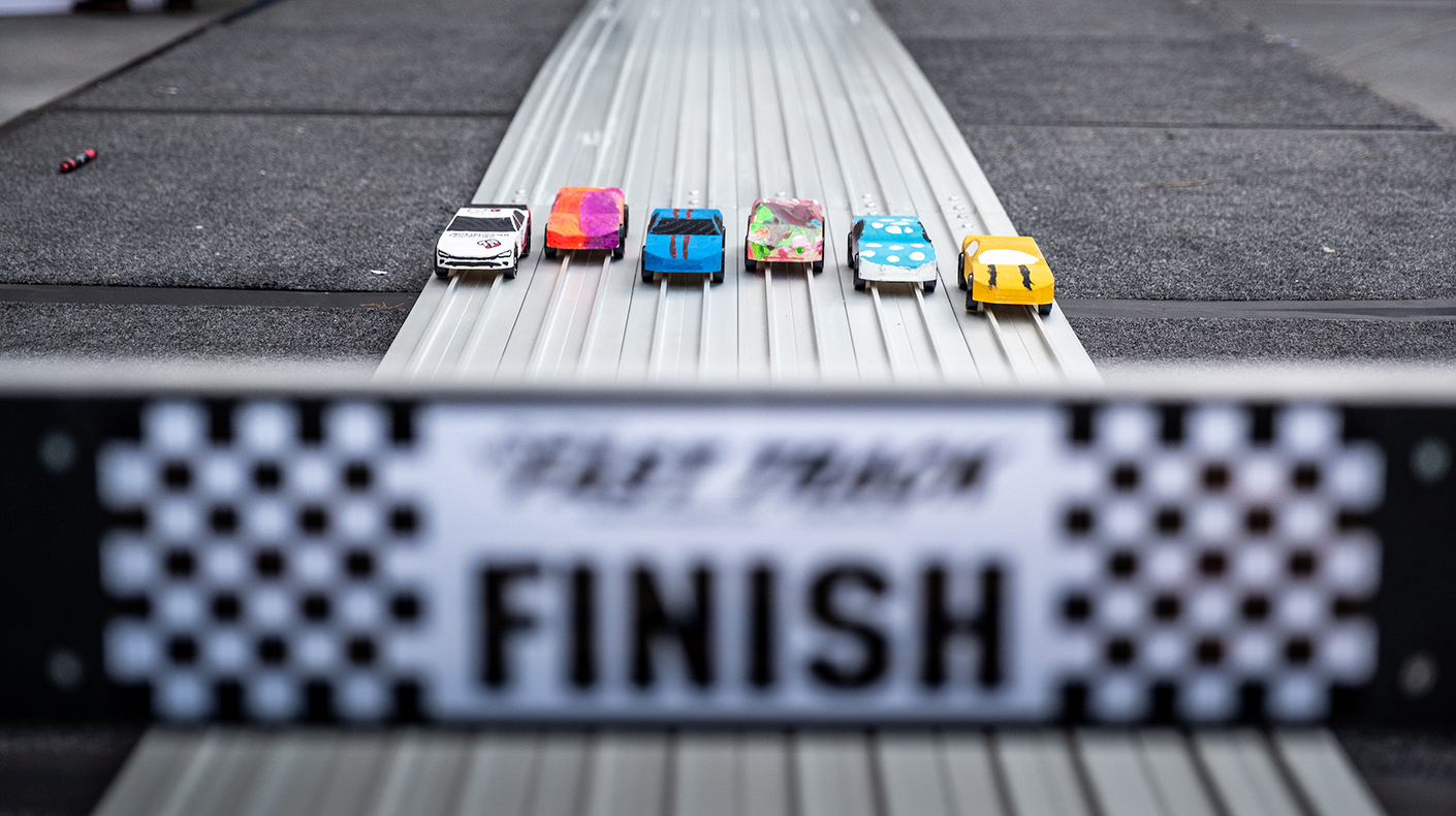 Pinewood cars on track during the SEMA Industry Cup Challenge.