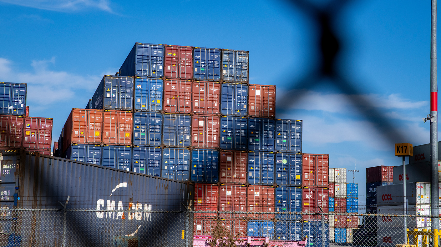 Shipping containers stacked at a port.
