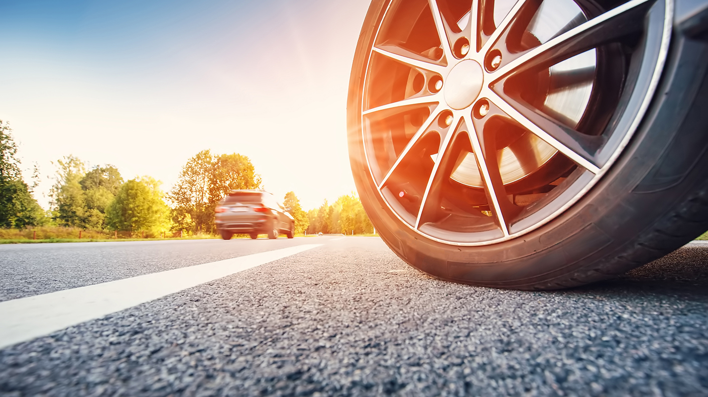 A close up of a tire on the road.