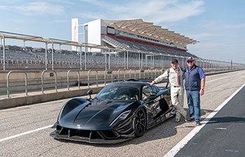Hennessey test driver David Donohue next to a Venom F5