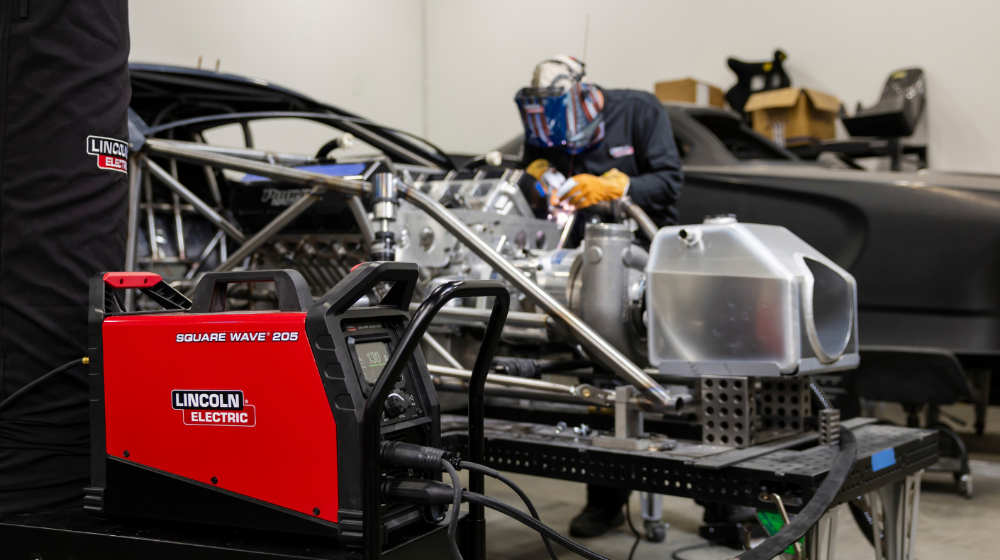 Welder using Lincoln Electric equipment.
