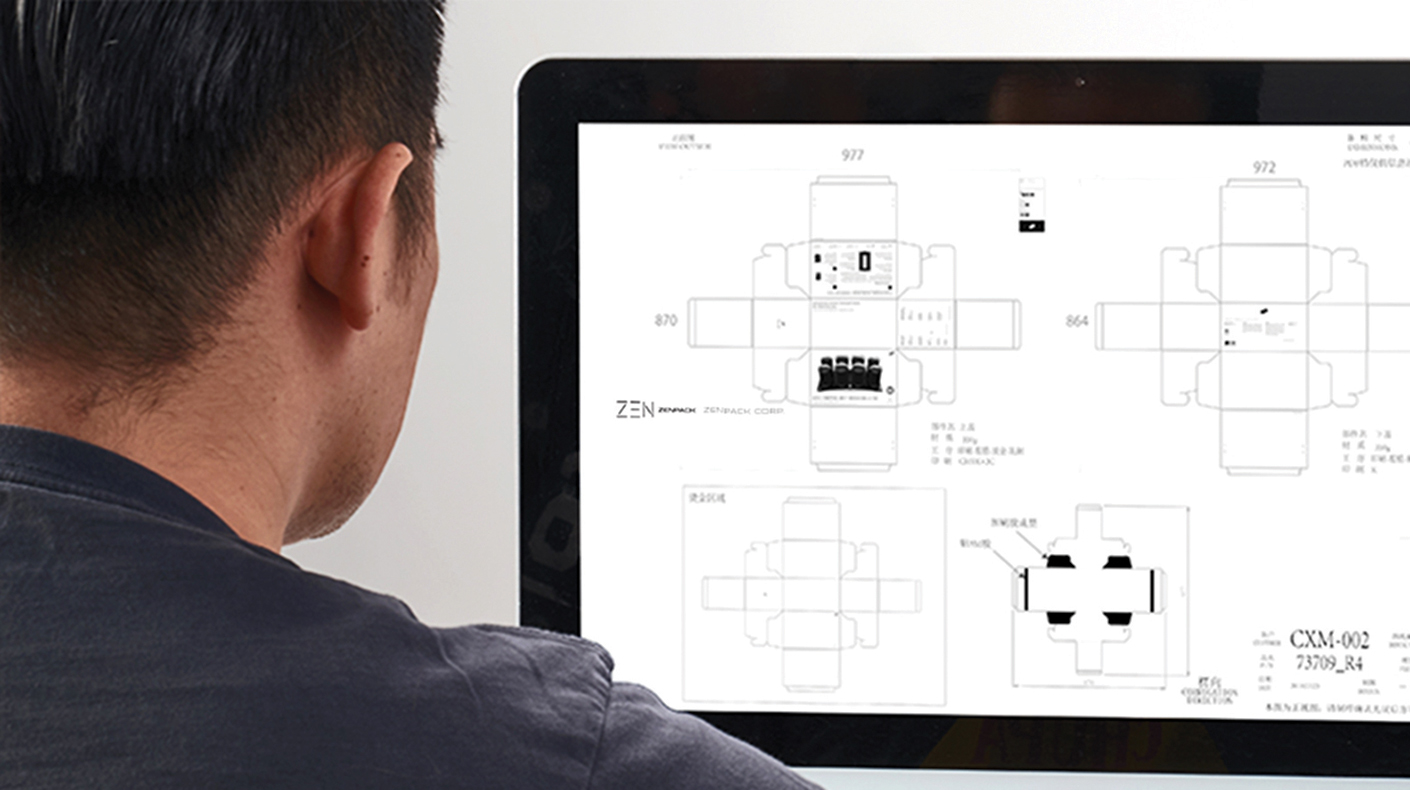 A designer working on plans for new packaging.