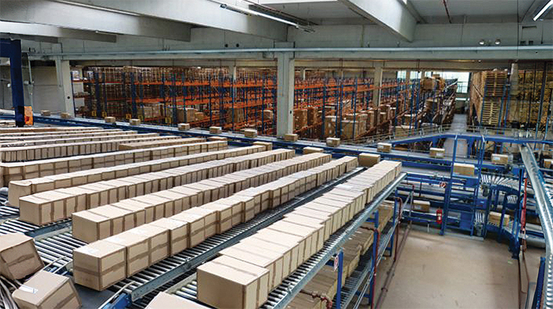 A warehouse facility with packages on a conveyor belt.