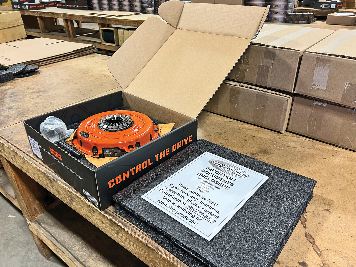 An open box containing a Centerforce clutch kit.